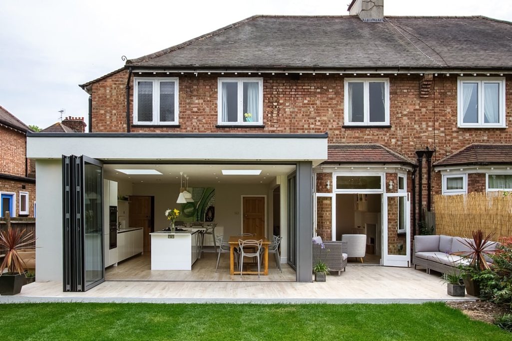 House Extension Modern extension of a brick house featuring a patio and open living space.